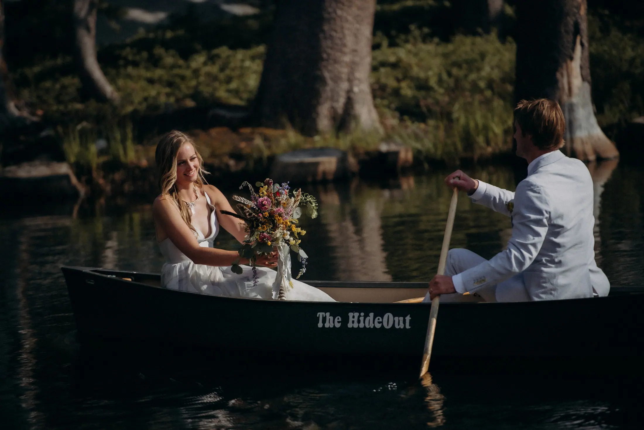 A canoe named The Hideout on the private lake.